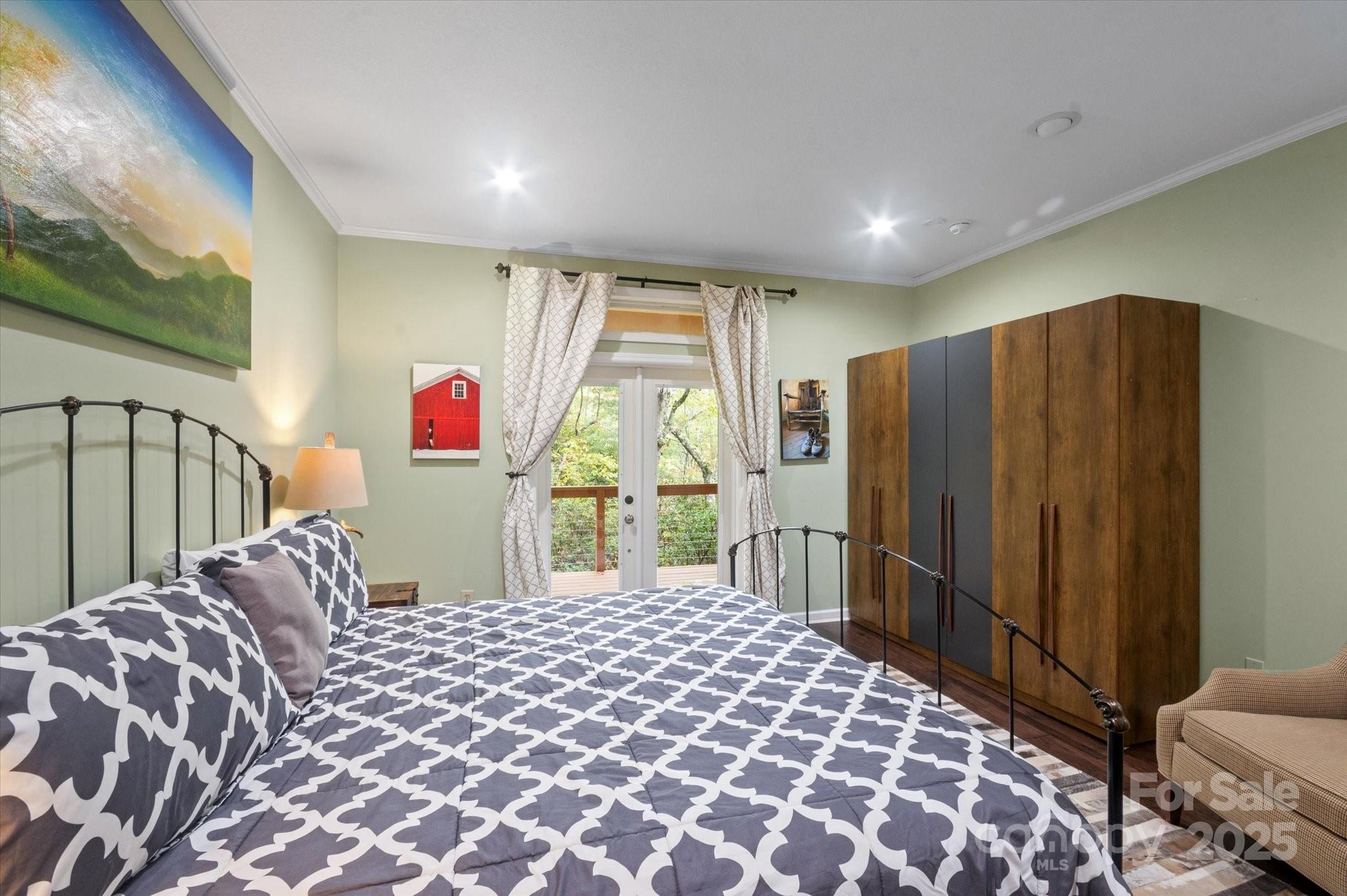 94 Davey Crockett Road Fairview, NC 28730 - Photo 12 of 41 a bed sitting in a room next to a window