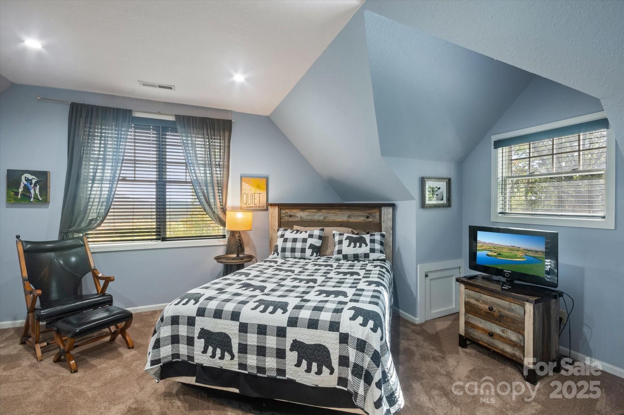 94 Davey Crockett Road Fairview, NC 28730 - Photo 20 of 41 a bedroom with a bed next to a window
