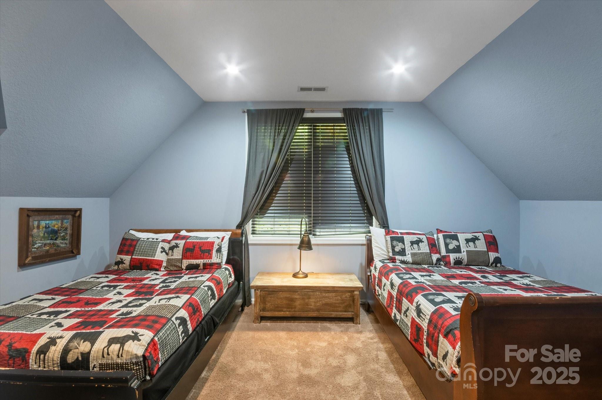 94 Davey Crockett Road Fairview, NC 28730 - Photo 24 of 41 a bedroom with a bed and a window