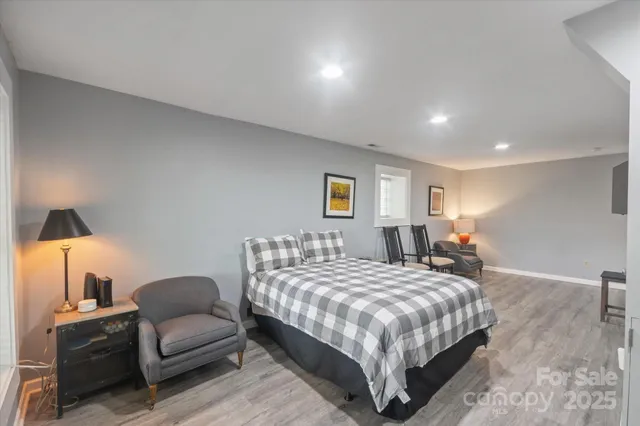 a bedroom with a bed and a lamp