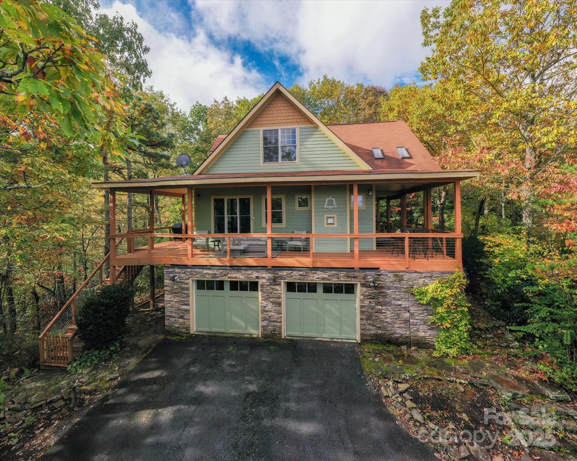 94 Davey Crockett Road Fairview, NC 28730 - Photo 32 of 41 a front view of a house with a yard table and chairs