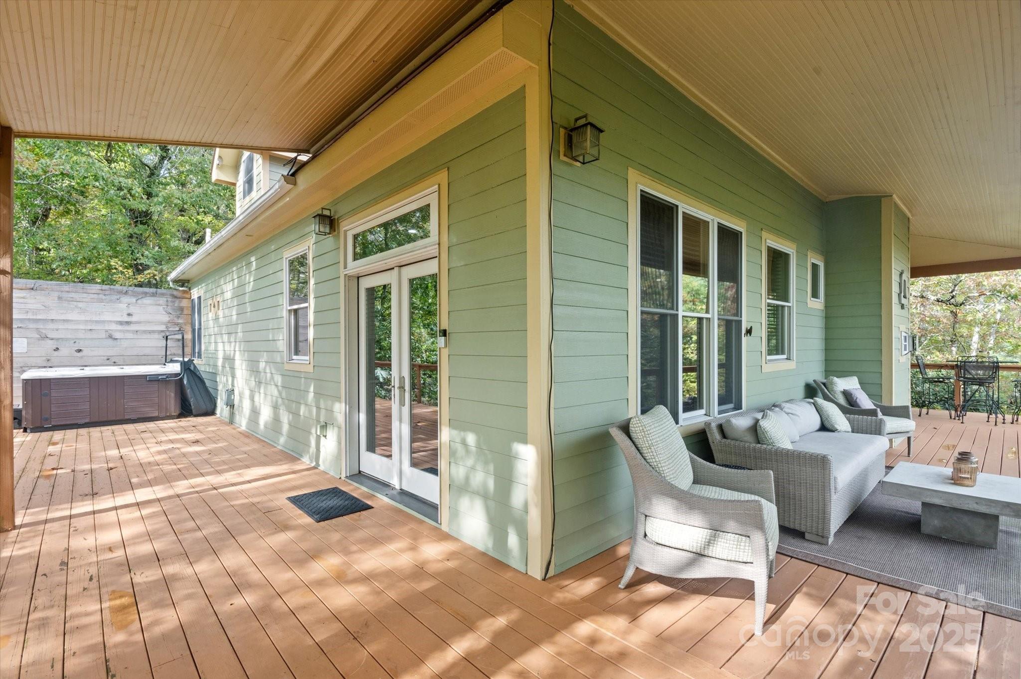 94 Davey Crockett Road Fairview, NC 28730 - Photo 34 of 41 a balcony with furniture and a potted plant