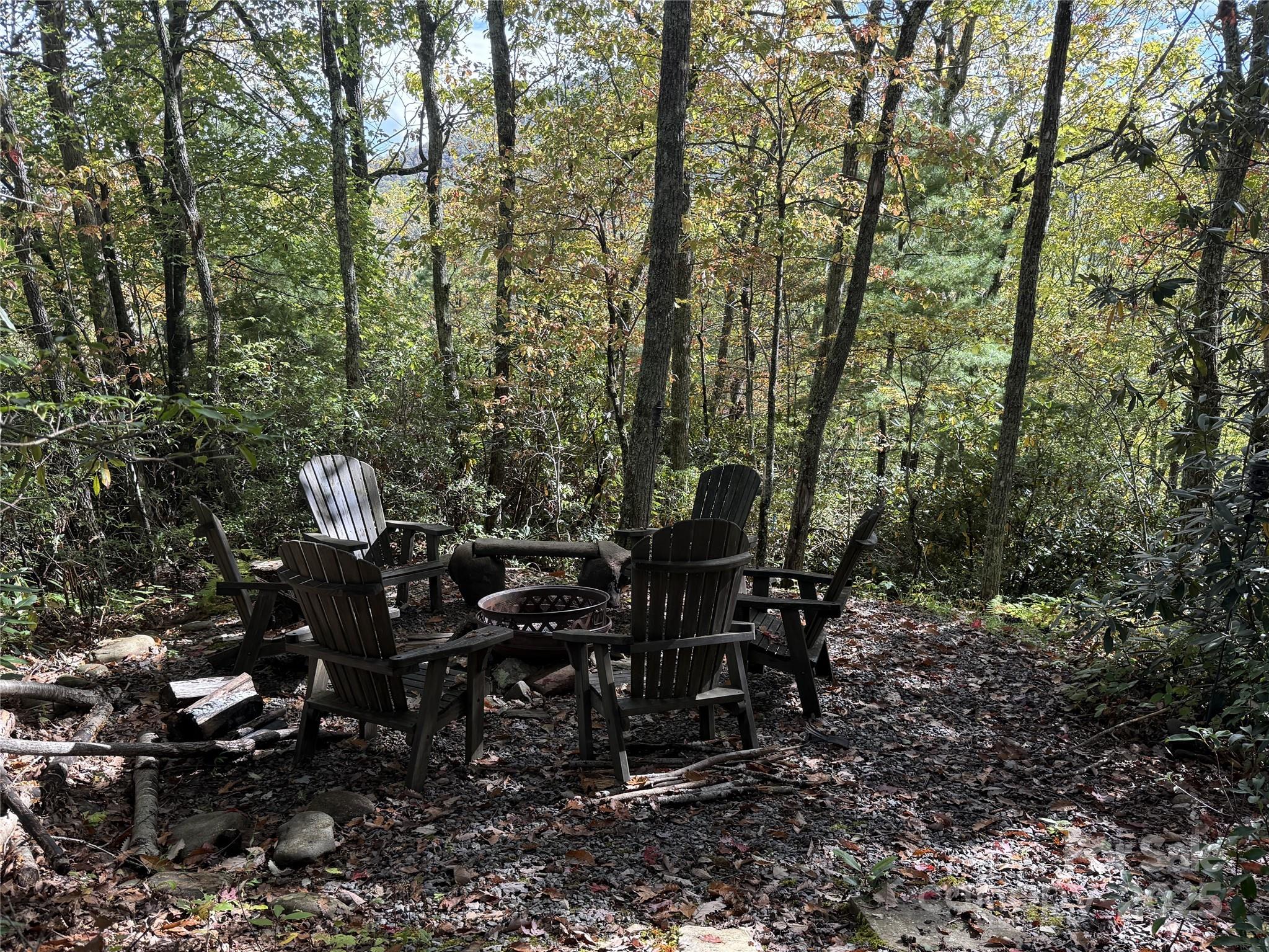 94 Davey Crockett Road Fairview, NC 28730 - Photo 36 of 41 a view of a tables and chairs on the deck