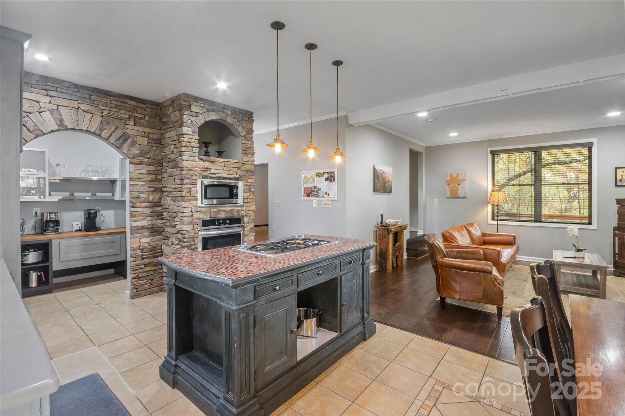 94 Davey Crockett Road Fairview, NC 28730 - Photo 8 of 41 a kitchen with a stove and chairs