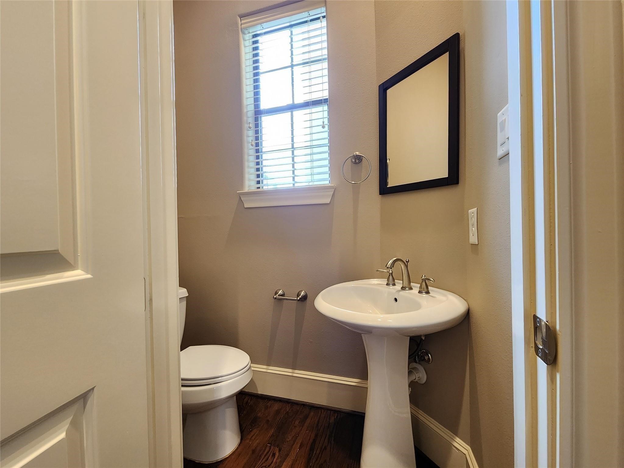 3205 Center Street Houston, TX 77007 - Photo 11 of 24 a bathroom with a sink toilet and a mirror