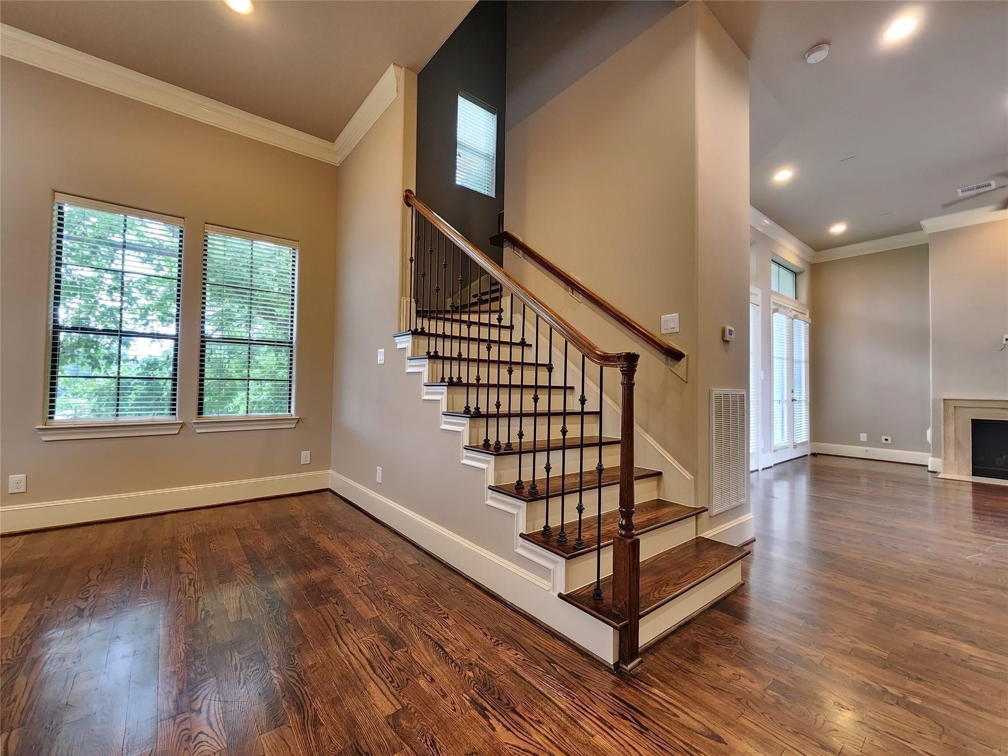 3205 Center Street Houston, TX 77007 - Photo 7 of 24 a view of entryway with wooden floor and stairs