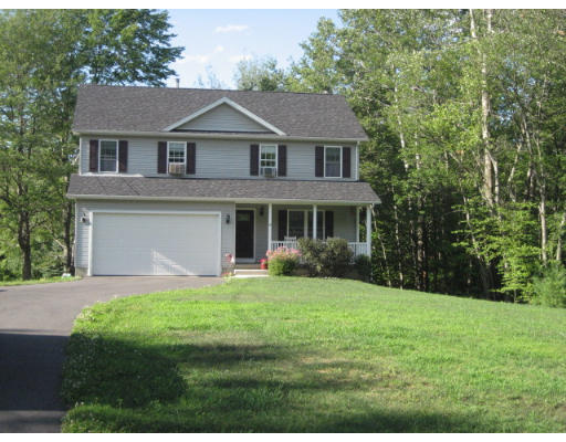 10 Reservoir Road Southwick, MA 01077 - Photo 1 of 1 a front view of a house with a yard and garage