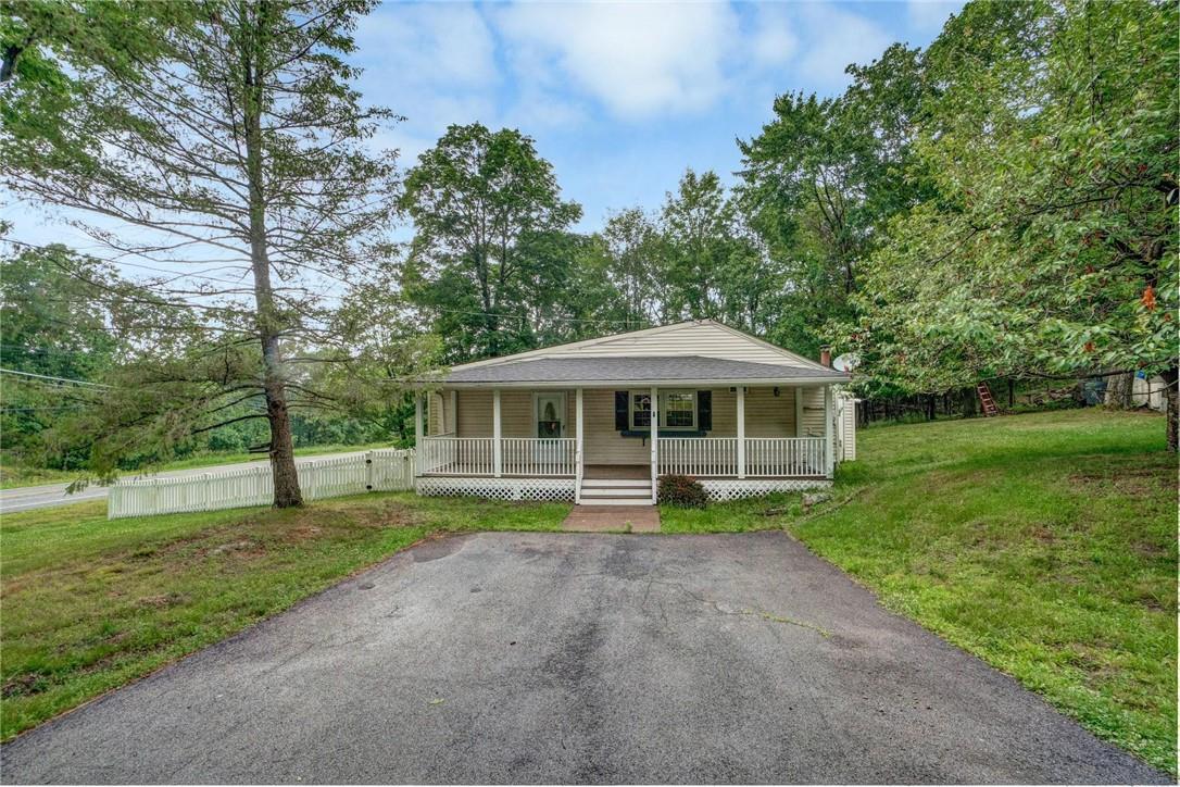 1 Haight Road Monroe, NY 10950 - Photo 1 of 1 a yellow house with a yard and large trees