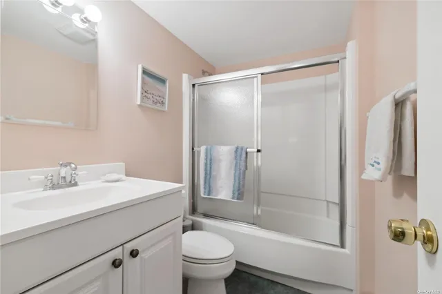 a bedroom with two beds and a window