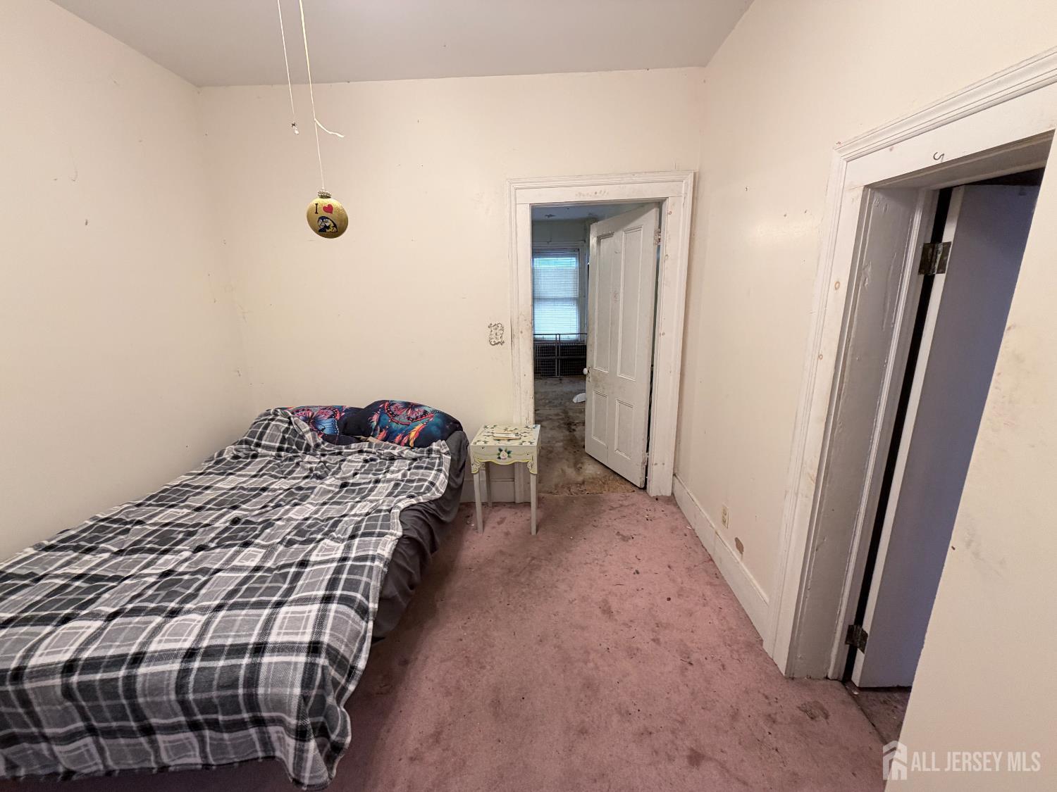 41 Atlantic Street Keyport, NJ 07735 - Photo 18 of 48 a bedroom with a bed and a mirror