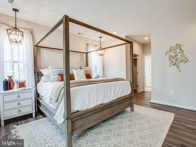 a bed room with a bed and a window