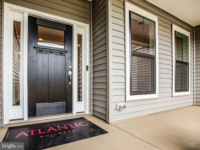 a view of wooden door and a window
