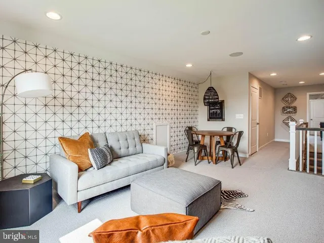 a living room with furniture and a table