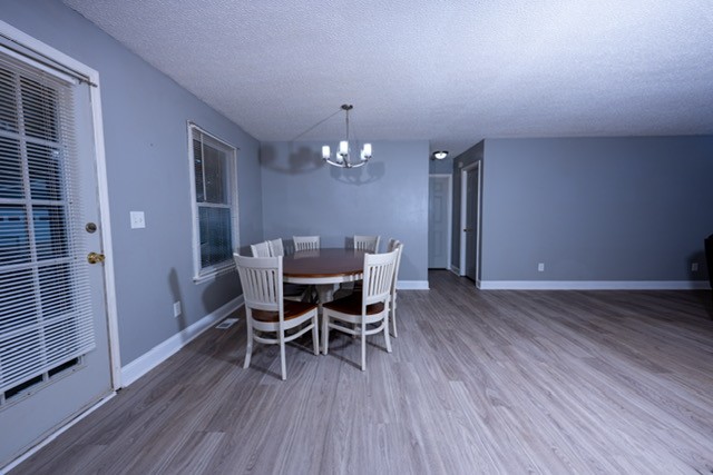 1177 Bethel Road Pulaski, TN 38478 - Photo 9 of 15 a dining room with furniture and wooden floor