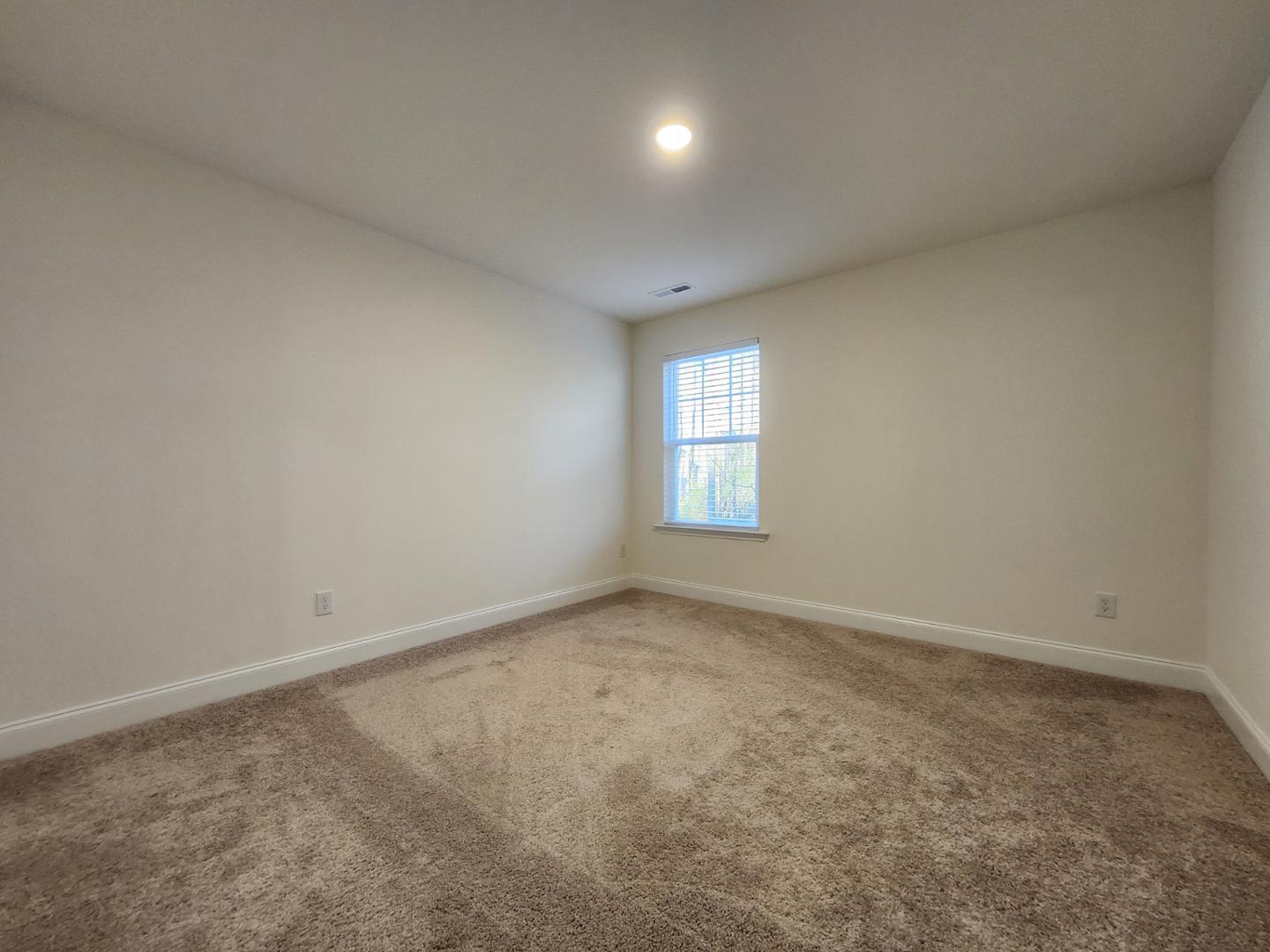 1224 Weavers Trce Drive Zebulon, NC 27597 - Photo 14 of 21 an empty room with windows