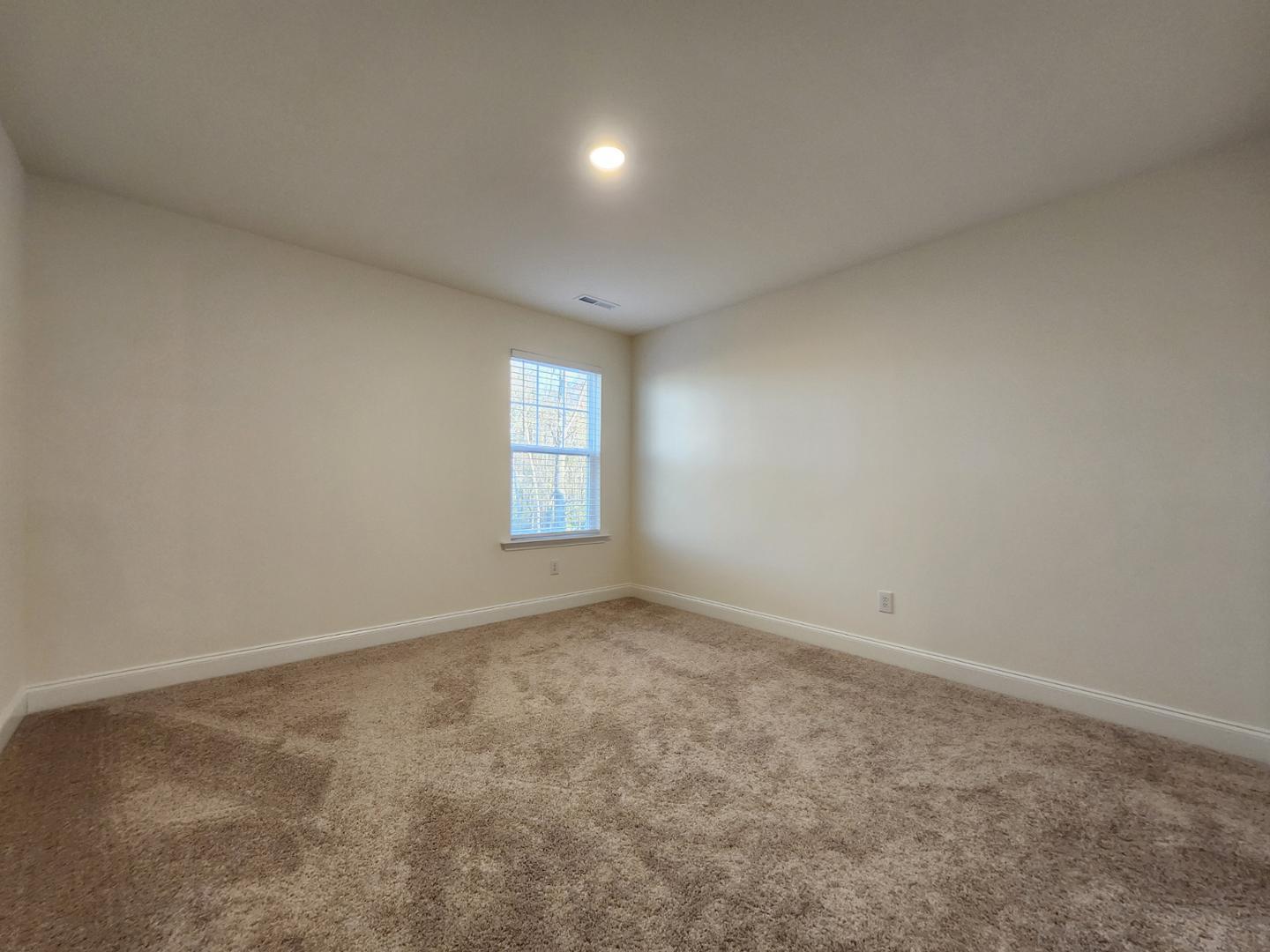 1224 Weavers Trce Drive Zebulon, NC 27597 - Photo 15 of 21 an empty room with windows