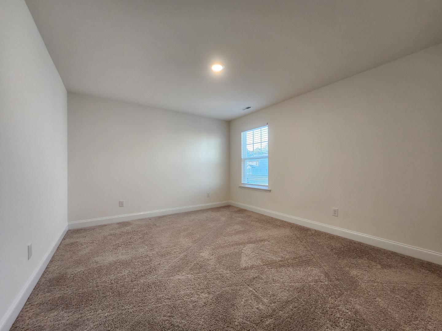 1224 Weavers Trce Drive Zebulon, NC 27597 - Photo 16 of 21 an empty room with windows
