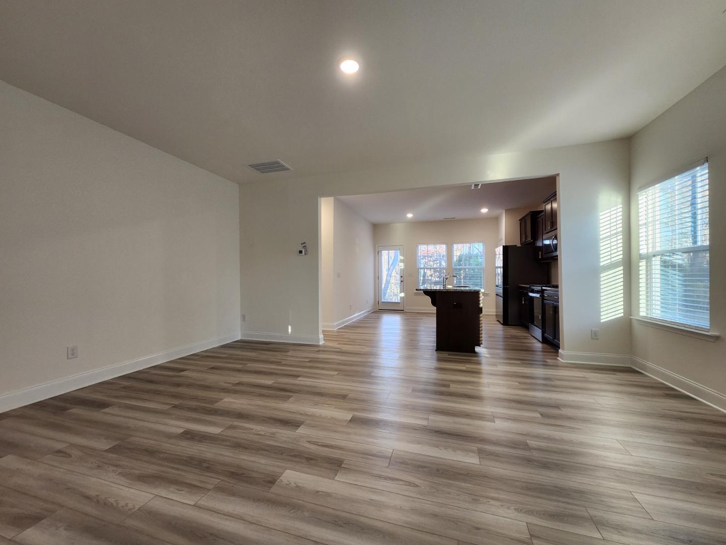 1224 Weavers Trce Drive Zebulon, NC 27597 - Photo 3 of 21 a view of a living room a kitchen with a hard wood floor