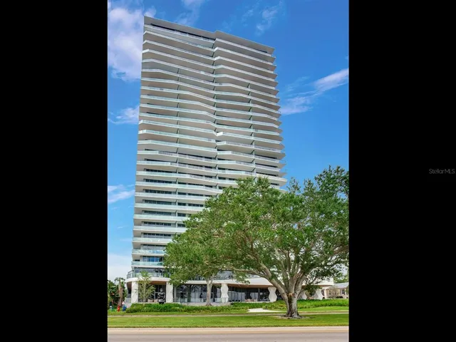 a view of a building and trees in the background