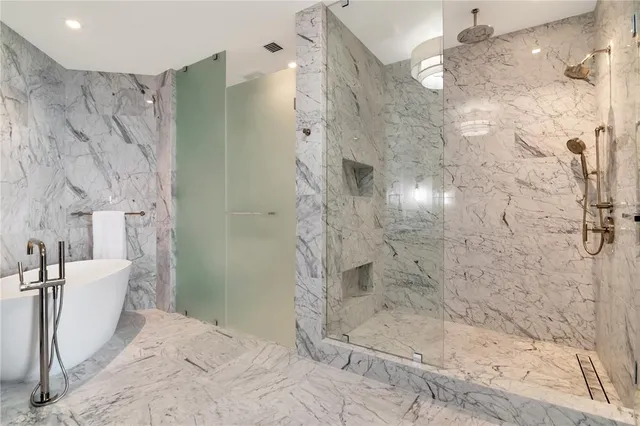 a living room with fireplace furniture and a large window