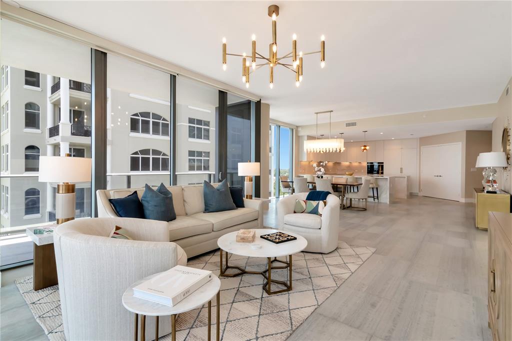 2912 West Santiago Street, Unit 804 Tampa, FL 33629 - Photo 42 of 95 a living room with furniture kitchen view and a chandelier