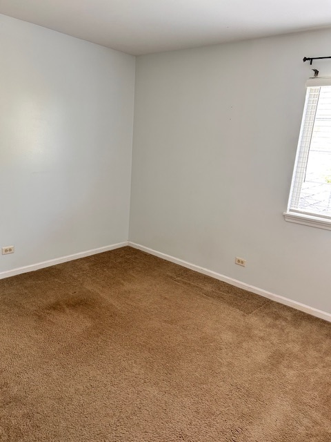 711 Violet Circle Naperville, IL 60540 - Photo 15 of 21 an empty room with a window