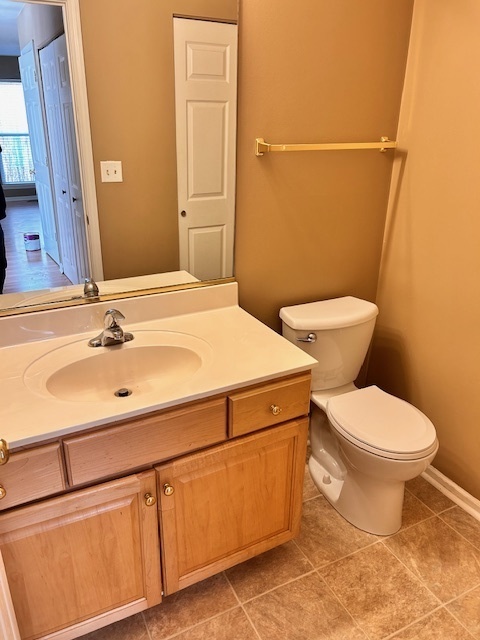 711 Violet Circle Naperville, IL 60540 - Photo 7 of 21 a bathroom with a sink mirror vanity and toilet