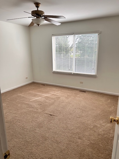 711 Violet Circle Naperville, IL 60540 - Photo 10 of 21 an empty room with a window