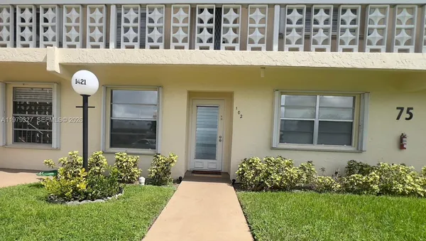 a front view of a house having yard