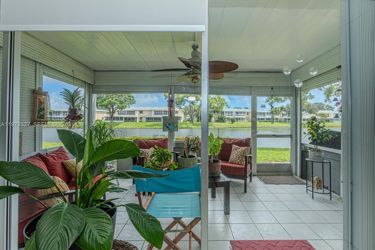 1421 Northwest 19th Terrace, Unit 102 Delray Beach, FL 33445 - Photo 20 of 30 a living room filled with furniture