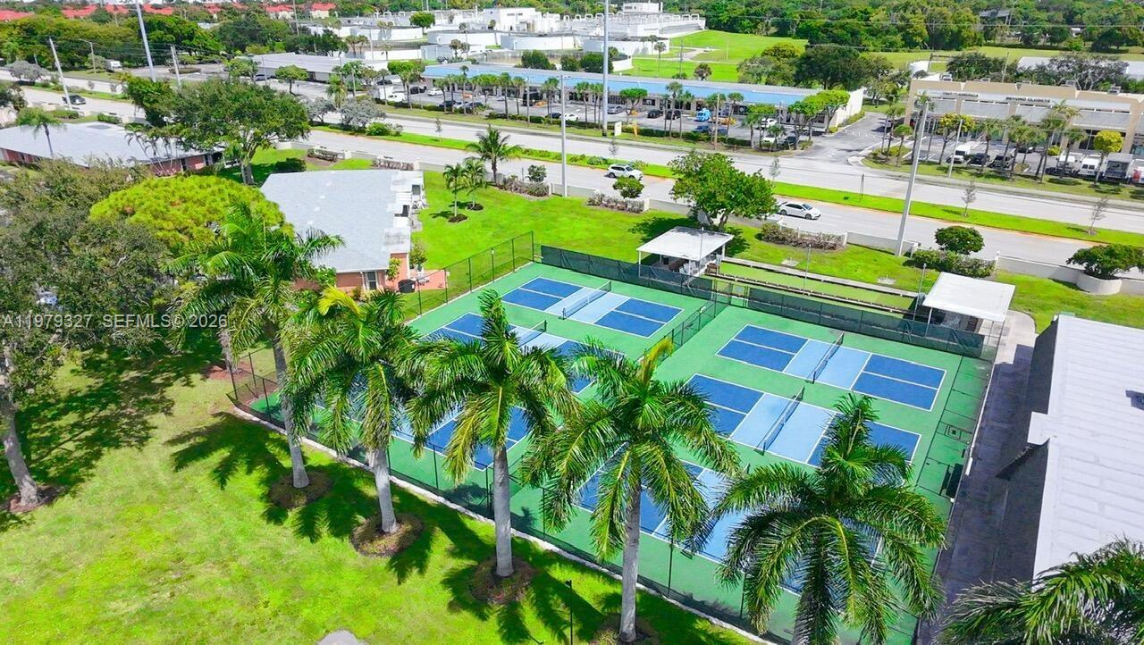 1421 Northwest 19th Terrace, Unit 102 Delray Beach, FL 33445 - Photo 30 of 30 a view of a swimming pool patio and lake view