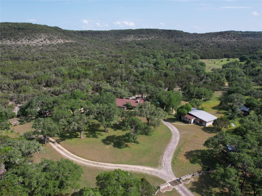 1500 Spoke Hollow Road Wimberley, TX 78676 - Photo 1 of 39 an aerial view of residential house with outdoor space and trees all around