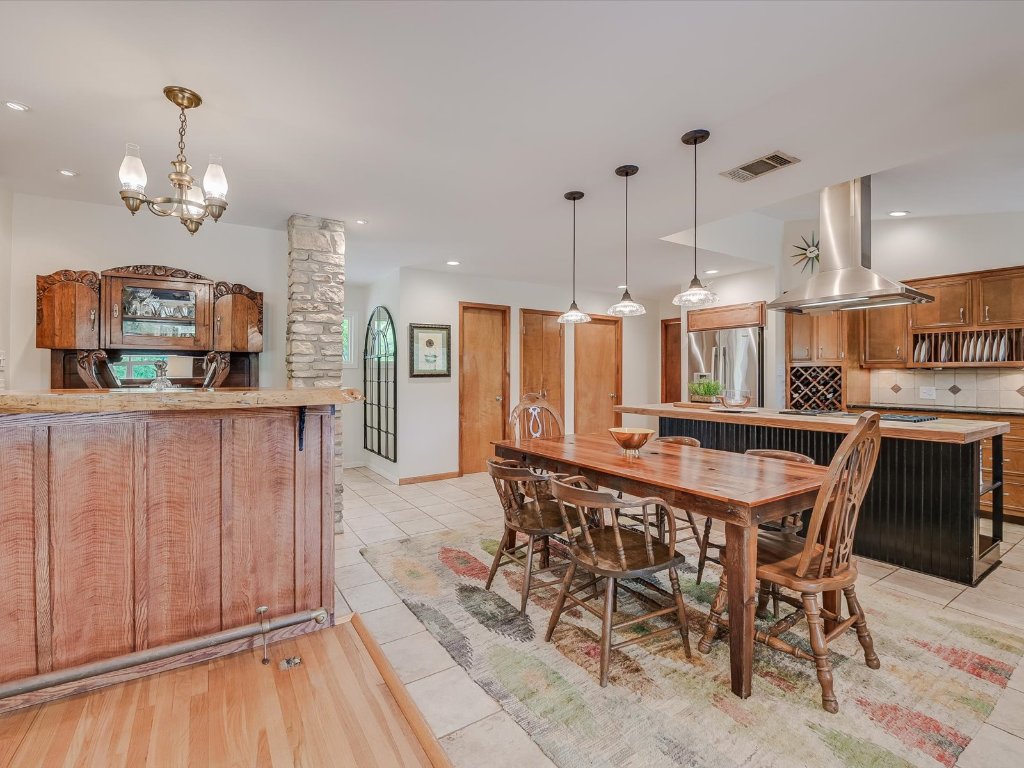 1500 Spoke Hollow Road Wimberley, TX 78676 - Photo 12 of 39 a large kitchen with a table and chairs
