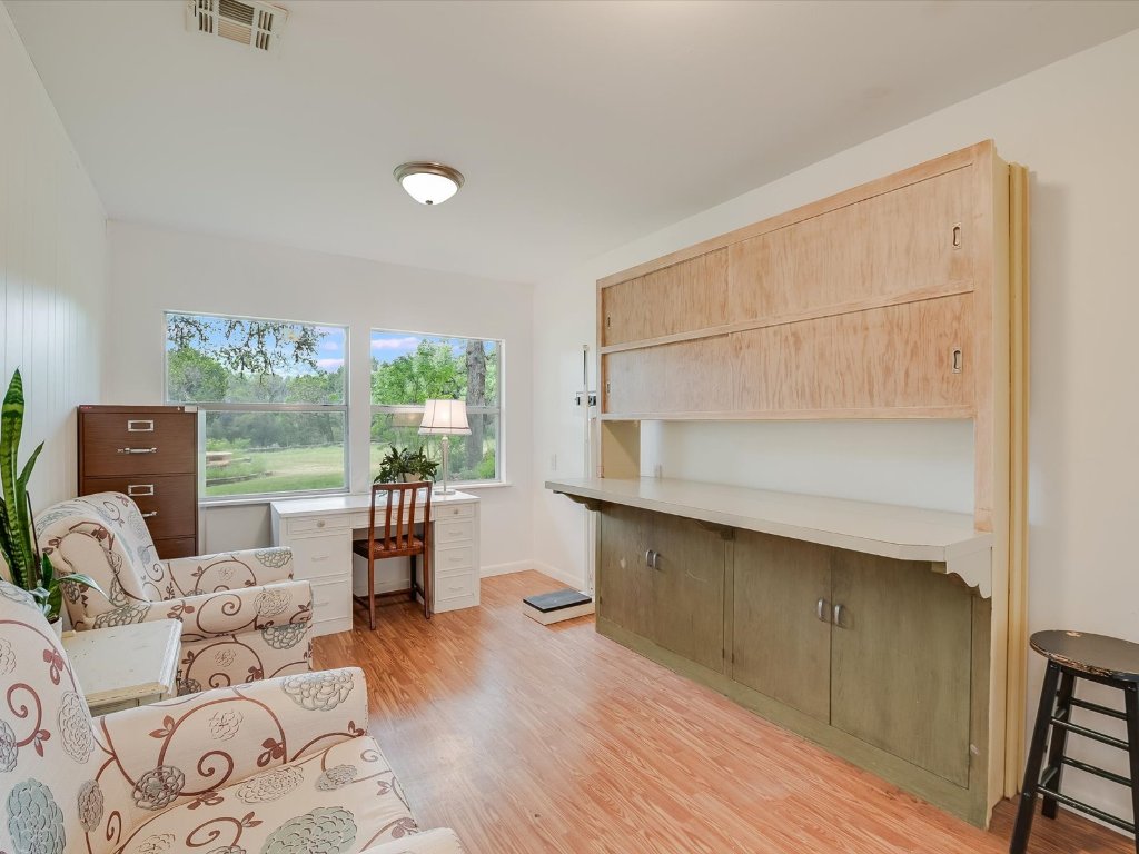 1500 Spoke Hollow Road Wimberley, TX 78676 - Photo 19 of 39 a living room with furniture and a large window
