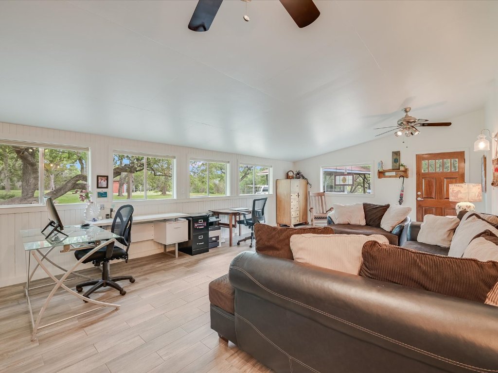 1500 Spoke Hollow Road Wimberley, TX 78676 - Photo 23 of 39 a living room with furniture and a large window