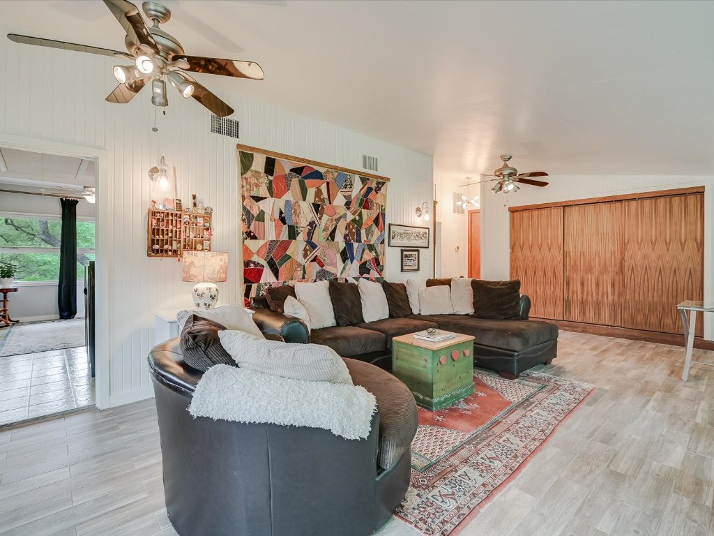 1500 Spoke Hollow Road Wimberley, TX 78676 - Photo 24 of 39 a living room with furniture and a wooden floor