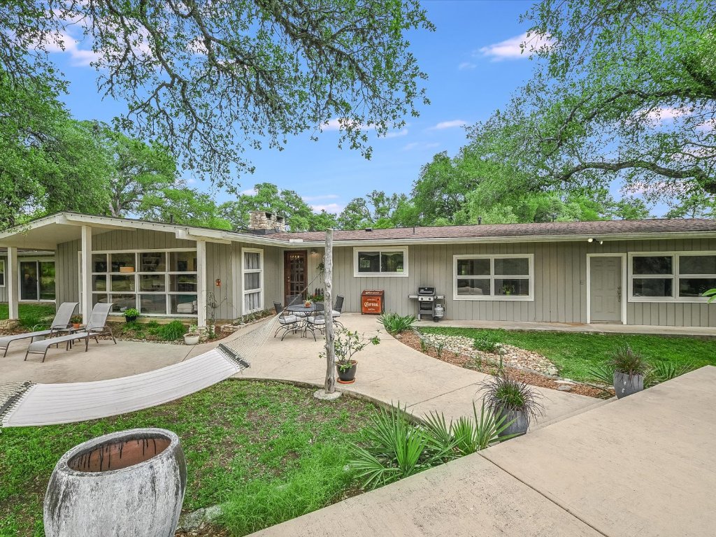 1500 Spoke Hollow Road Wimberley, TX 78676 - Photo 27 of 39 front view of house with a yard chairs