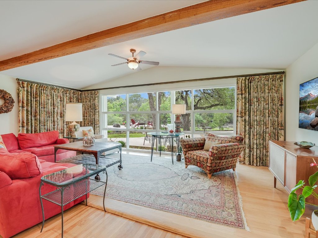 1500 Spoke Hollow Road Wimberley, TX 78676 - Photo 9 of 39 a living room with furniture and a flat screen tv