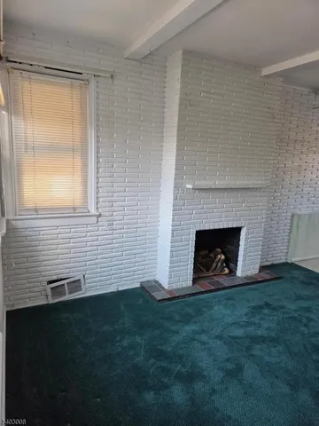 a view of a fireplace with a yard in front of it