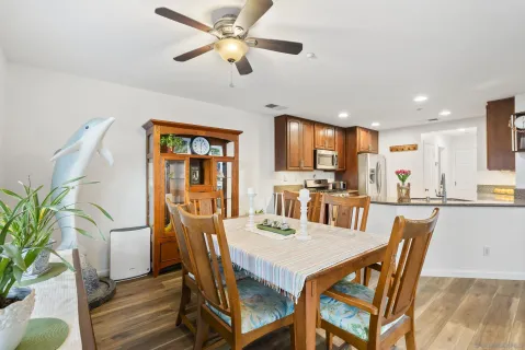 a kitchen with stainless steel appliances granite countertop a sink refrigerator and microwave