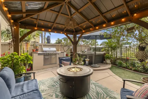 a view of a chairs and table in a patio