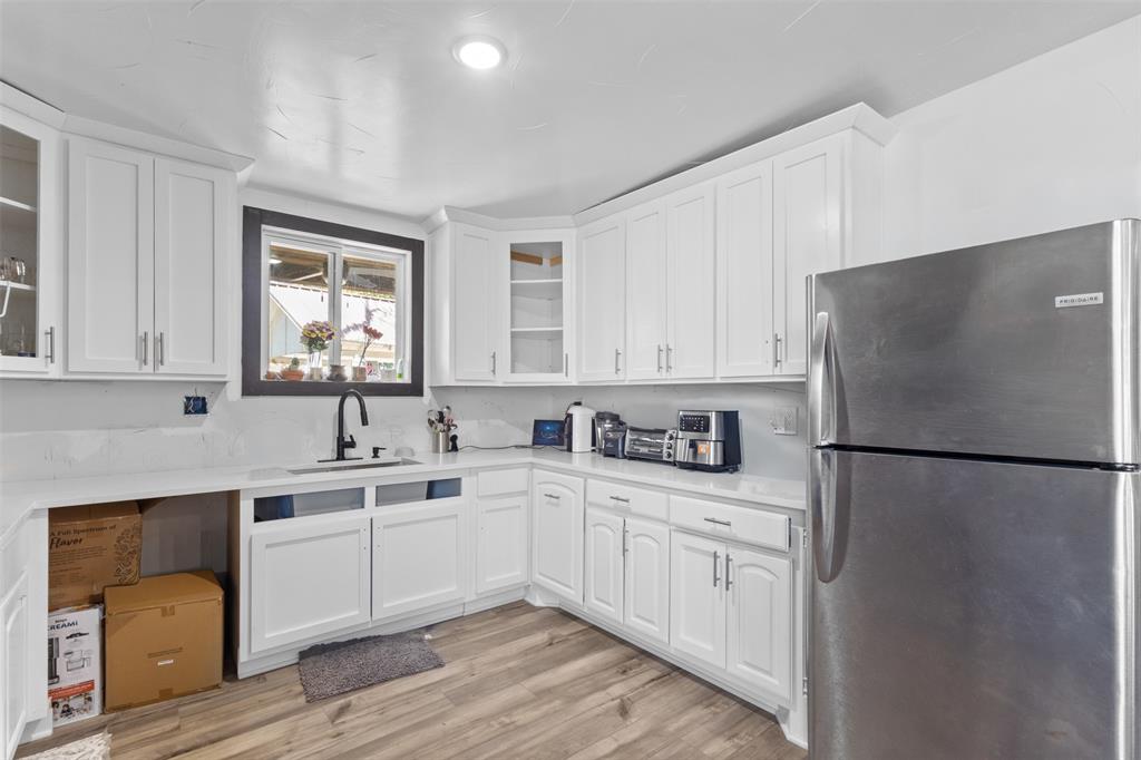 3300 Jordan Valley Road Dallas, TX 75253 - Photo 13 of 25 a kitchen with white cabinets and white appliances