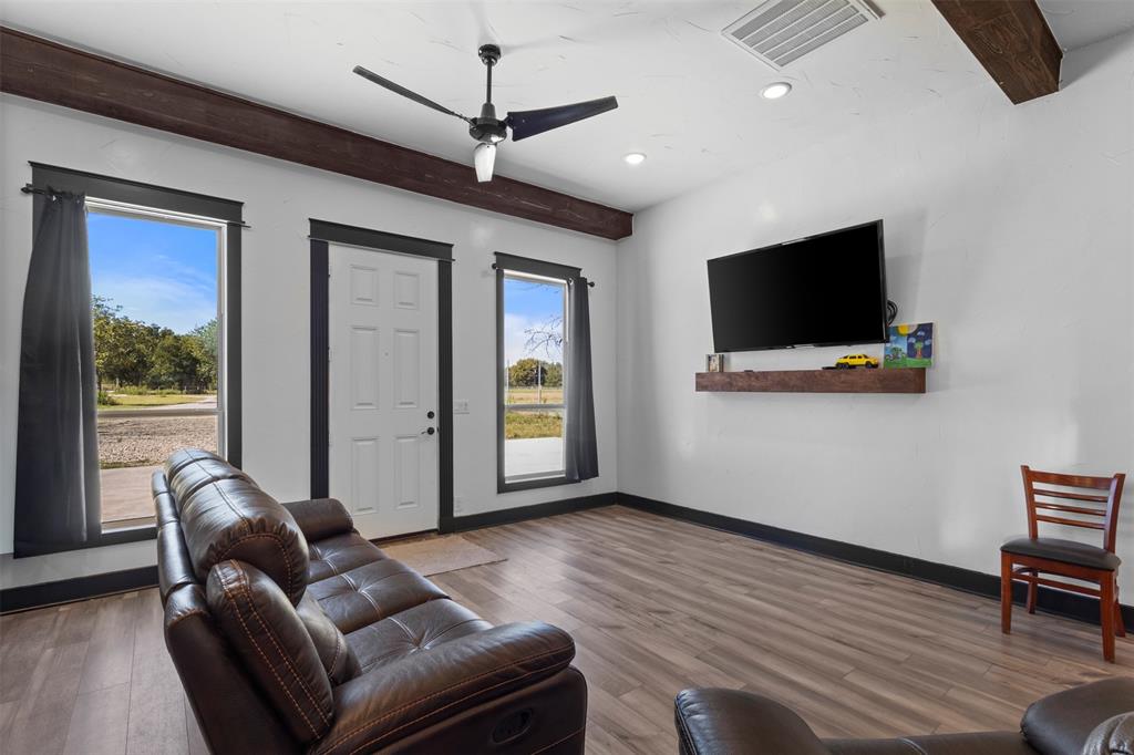 3300 Jordan Valley Road Dallas, TX 75253 - Photo 4 of 25 a living room with furniture and a flat screen tv