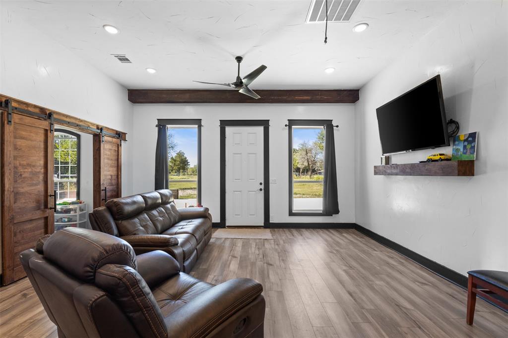 3300 Jordan Valley Road Dallas, TX 75253 - Photo 5 of 25 a living room with furniture and a flat screen tv
