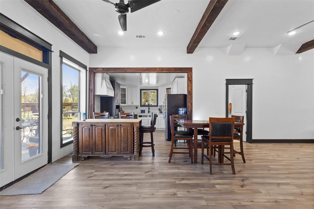 3300 Jordan Valley Road Dallas, TX 75253 - Photo 9 of 25 a view of a dining room with furniture window and wooden floor