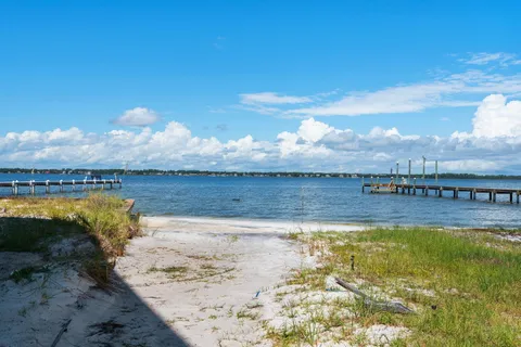 a view of a swimming pool and an outdoor seating