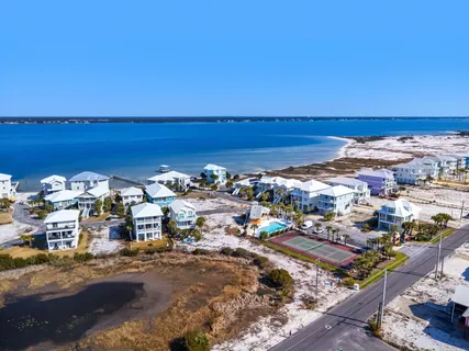 an aerial view of residential building and ocean