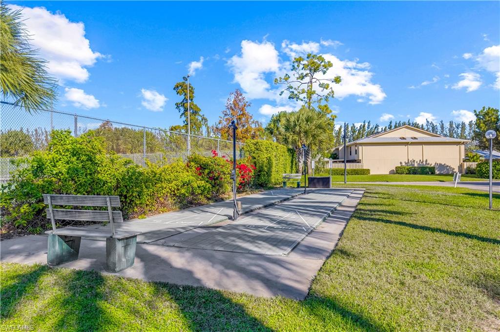 150 Turtle Lake Court, Unit 307 Naples, FL 34105 - Photo 14 of 27 a view of a backyard with a garden