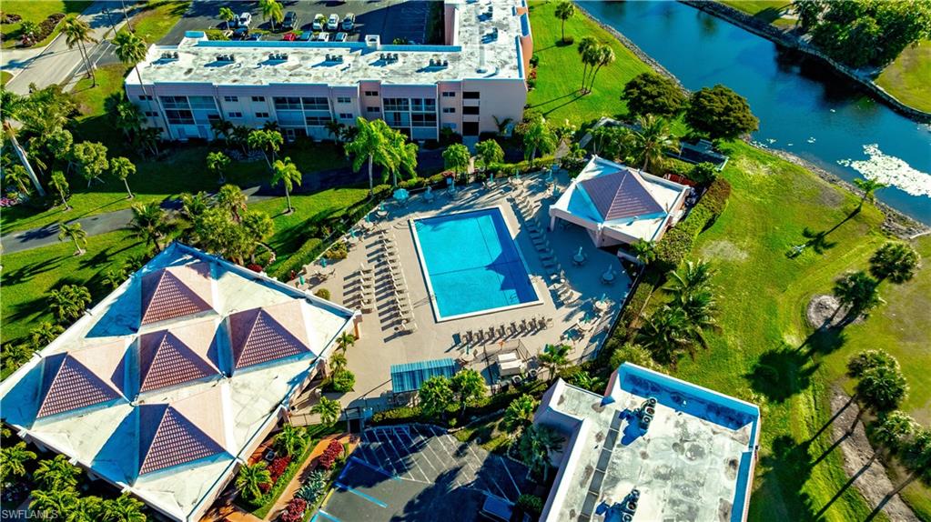 150 Turtle Lake Court, Unit 307 Naples, FL 34105 - Photo 27 of 27 an aerial view of multiple houses with yard