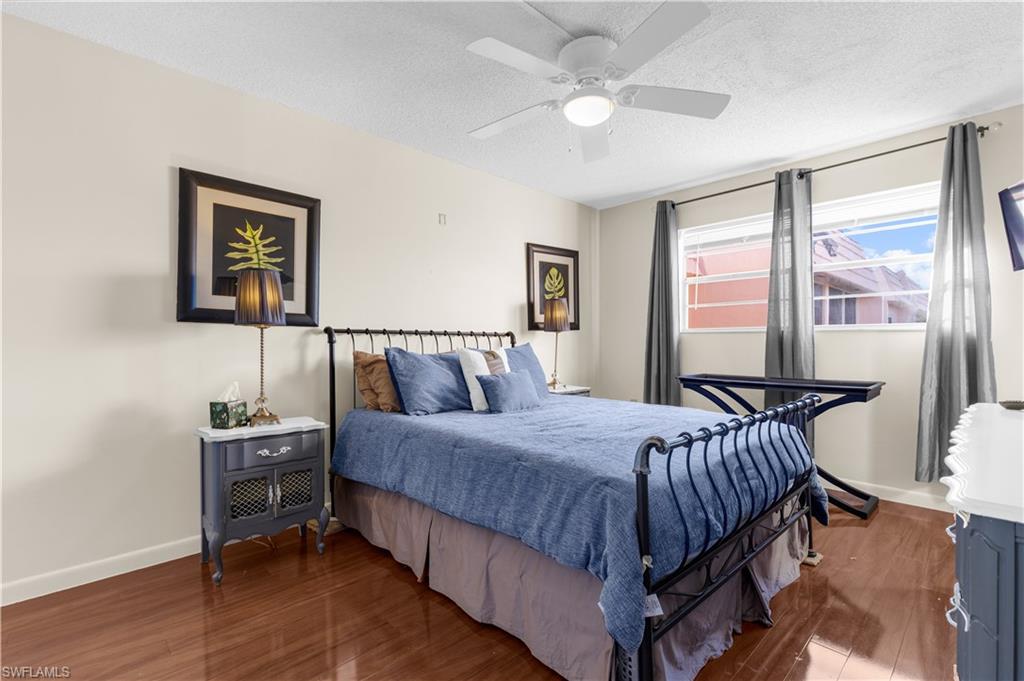 150 Turtle Lake Court, Unit 307 Naples, FL 34105 - Photo 7 of 27 a bedroom with a bed and a window
